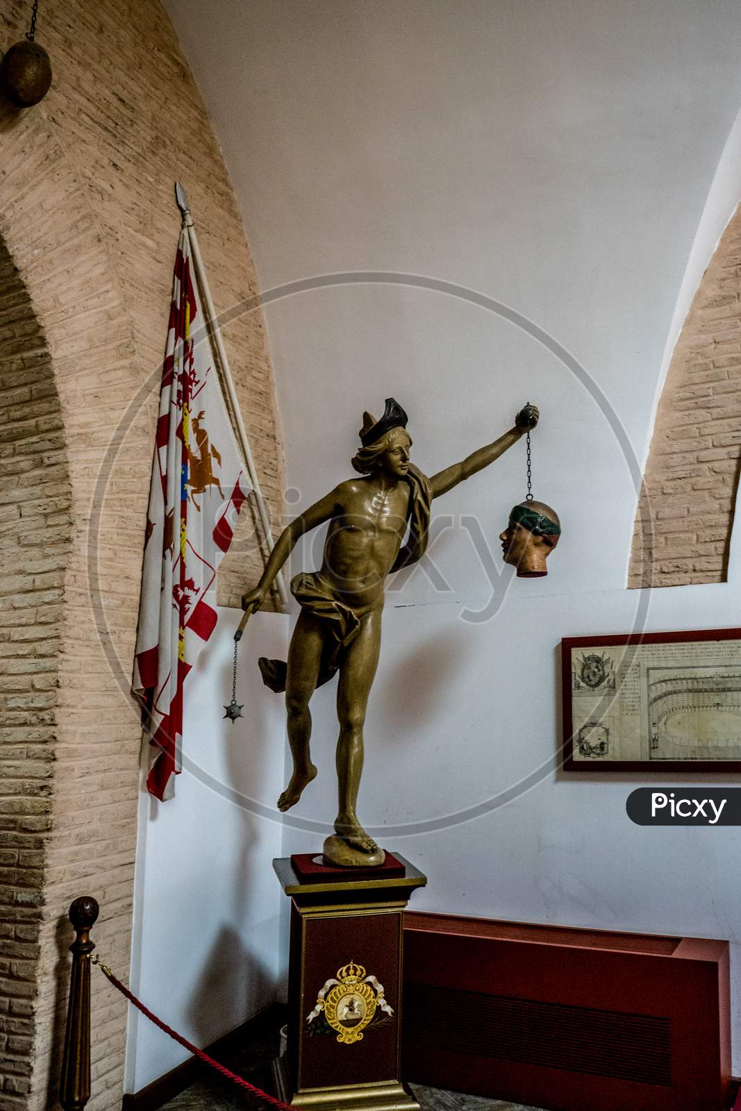 Seville, Spain- June 18, 2017:  A Statue Of An Person Holding A Head And A Mace Is Placed Inside The Bull Fighting Ring In Seville, Spain June 2017, Europe