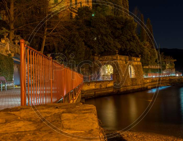 Italy, Lecco, Lake Como, Lovers Walkng Path At Night In Varenna