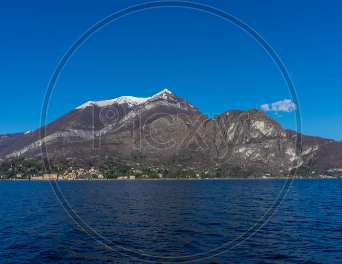 Italy, Bellagio, Lake Como With Snow Covered Peaks Background