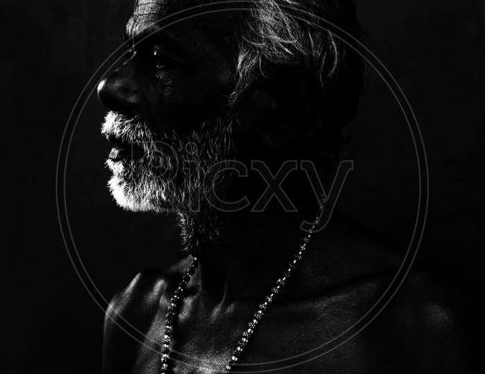 Close Up Portrait Of Pensive Old Bearded Man Looking At Camera. He Expresses Sincerity, Openness While His Eye Is Filled With Nostalgia
