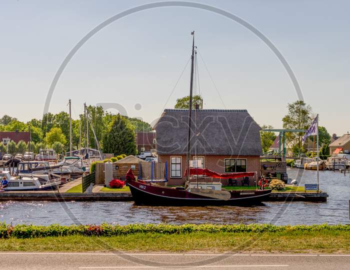 Giethoorn, Netherlands - 26 May: A Boat Is Docked At Giethoorn On 26 May 2017. Giethoorn Is The Venice Of Netherlands