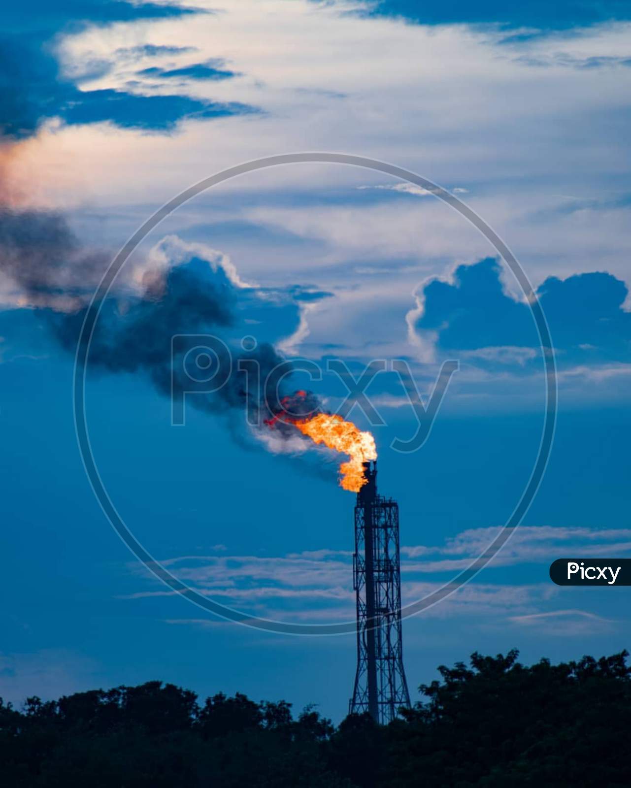 Close Up Industrial View At Oil Refinery Plant Form Industry Zone With Sunrise And Cloudy Sky
