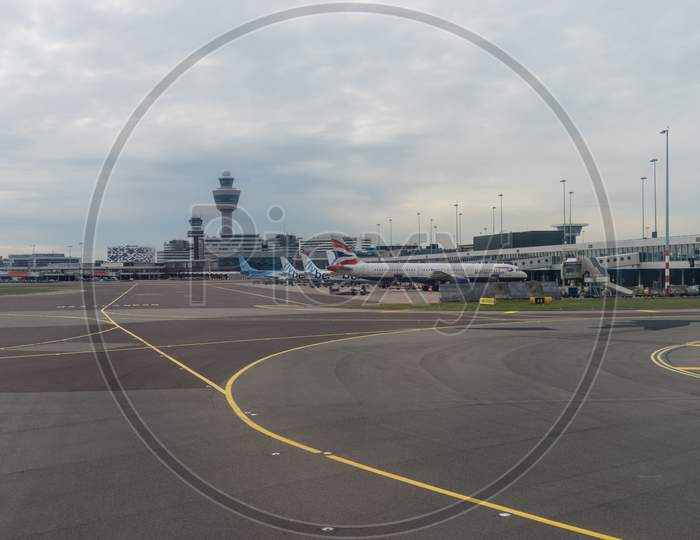 Netherlands, Amsterdam, Schiphol - 30 March, 2018: Planes At Airport. Schiphol Is One Of The Busiest Airport In Europe.