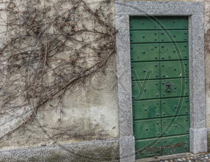 Italy, Varenna, Lake Como, A Close Up Of A Wooden Door