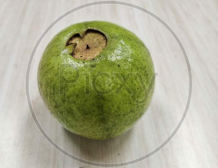 Closeup Shot Of A Guava In A White Background, Scientific Name : Psidium Guajava
