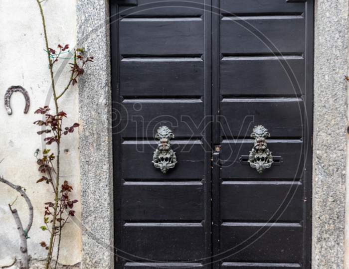 Italy, Varenna, Lake Como, A Close Up Of A Door With A Knob