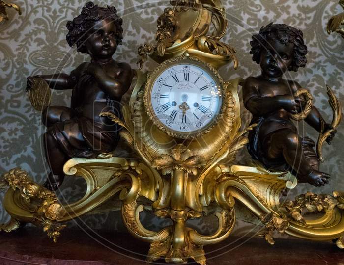 Varenna, Italy - March 31, 2018: Ancient Clock At Villa Monastero In Varenna On Cloudy Day. Lake Como, Lombardy, Italy