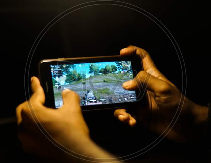 Close up shot of a Person playing Banned PubG Mobile Game in Smartphone