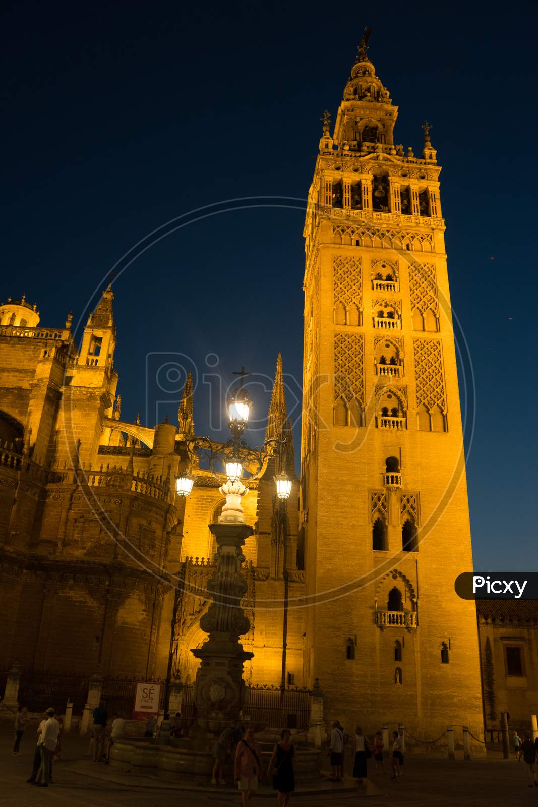 The Giralda Bell Tower Lit Up At Night In Seville, Spain, Europe