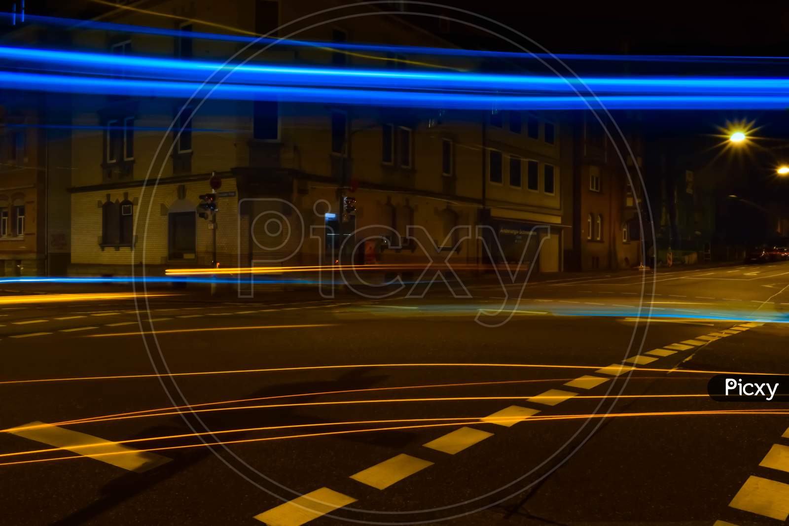 Light trails photo of a road crossing in Germany