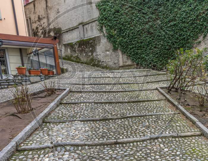 Italy, Varenna, Lake Como, A Close Up Of A Stone Staircase