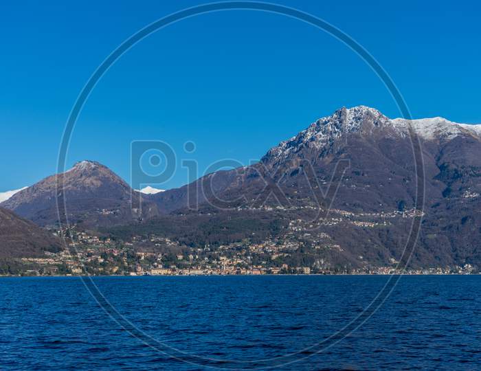 Italy, Bellagio, Lake Como With Snow Covered Peaks Background