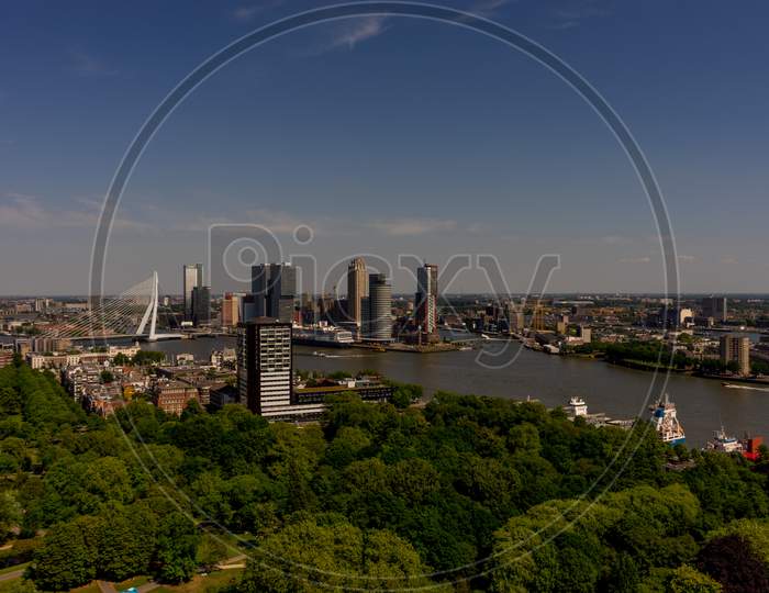 Netherlands, Rotterdam, The Cityscape And Skyline Of Rotterdam With Erasmus Bridge