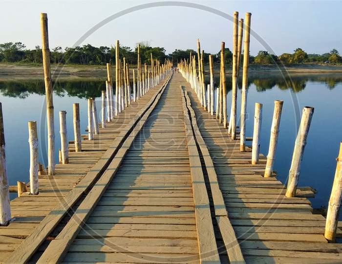Bamboo and Wood Bridge over Water