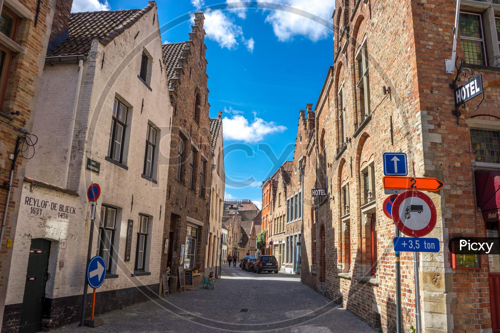 Brugge, Belgium - April 17 :  Toursists Walking On The Cobble Stoned Street At Bruges, Belgium, Europe
