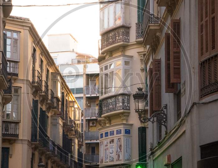 Spain, Malaga - 24 June 2017: A Group Of People Walking On A City Street