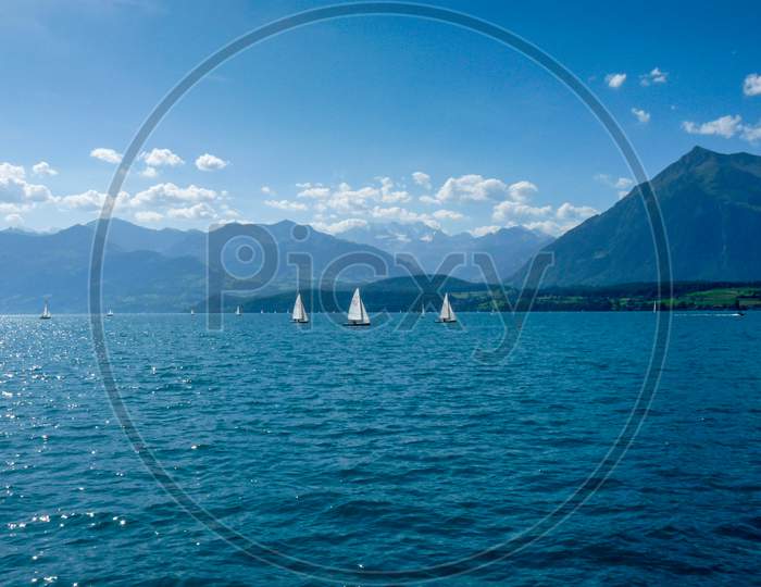 Switzerland, Lauterbrunnen, Sailboats In Sea Against Sky