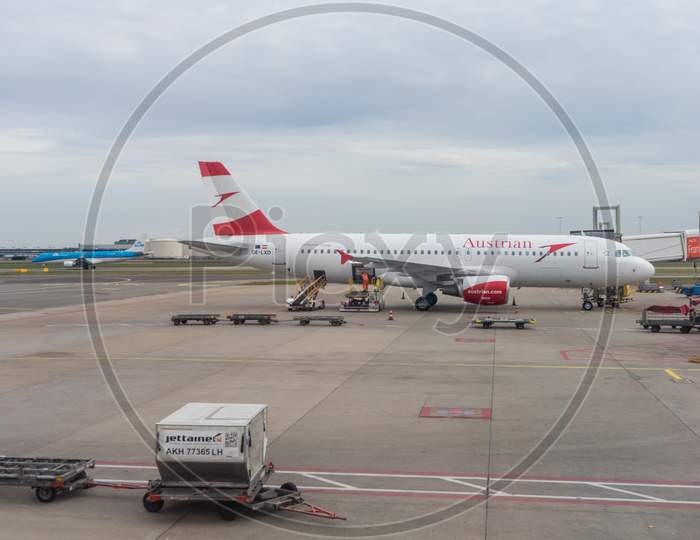 Netherlands, Amsterdam, Schiphol - 30 March, 2018: Austrian Planes At Airport. Schiphol Is One Of The Busiest Airport In Europe.