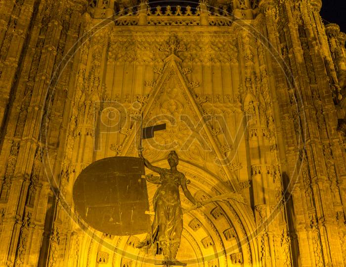 Seville, Spain- June 18, 2017:The Entrance Of The Gothic Cathedral Is Illuminated At Night In Seville, Spain June 2017, Europe