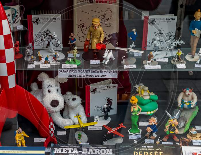 Brussels, Belgium - April 17 :  Memorabilia Of Tintin, Asterix And Obelix The Cartoon Character Popularised By Herge Comics Displayed On A Shop Window At Brussels, Belgium, Europe On April 17.