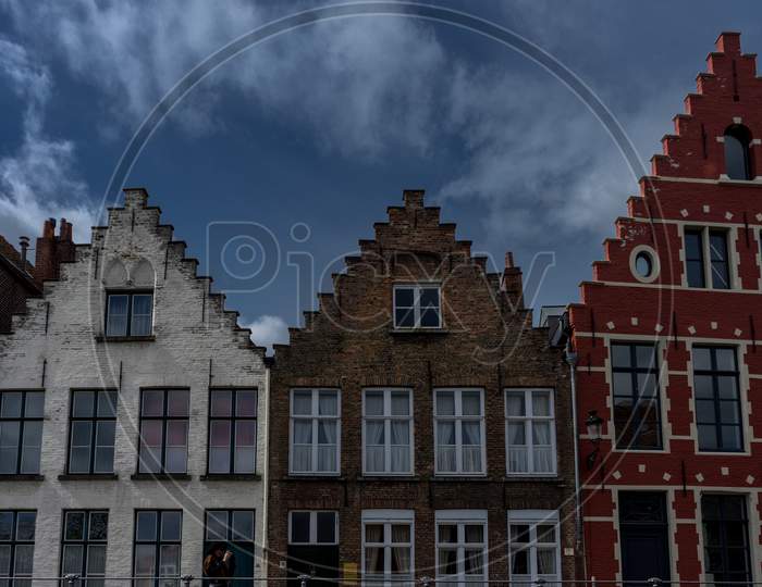 Brown, Red And White Rooftop With Gable And Steps On The Houses At Brugge, Belgium, Europe