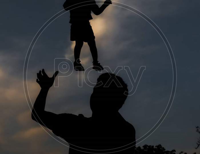 Happy Funny Little Kid Girl Flying In Fathers Arms Family Having Fun In Modern Studio Apartments, Loving Single Daddy Holding Lifting Cheerful School Daughter Playing Plane Enjoy Playtime At Home