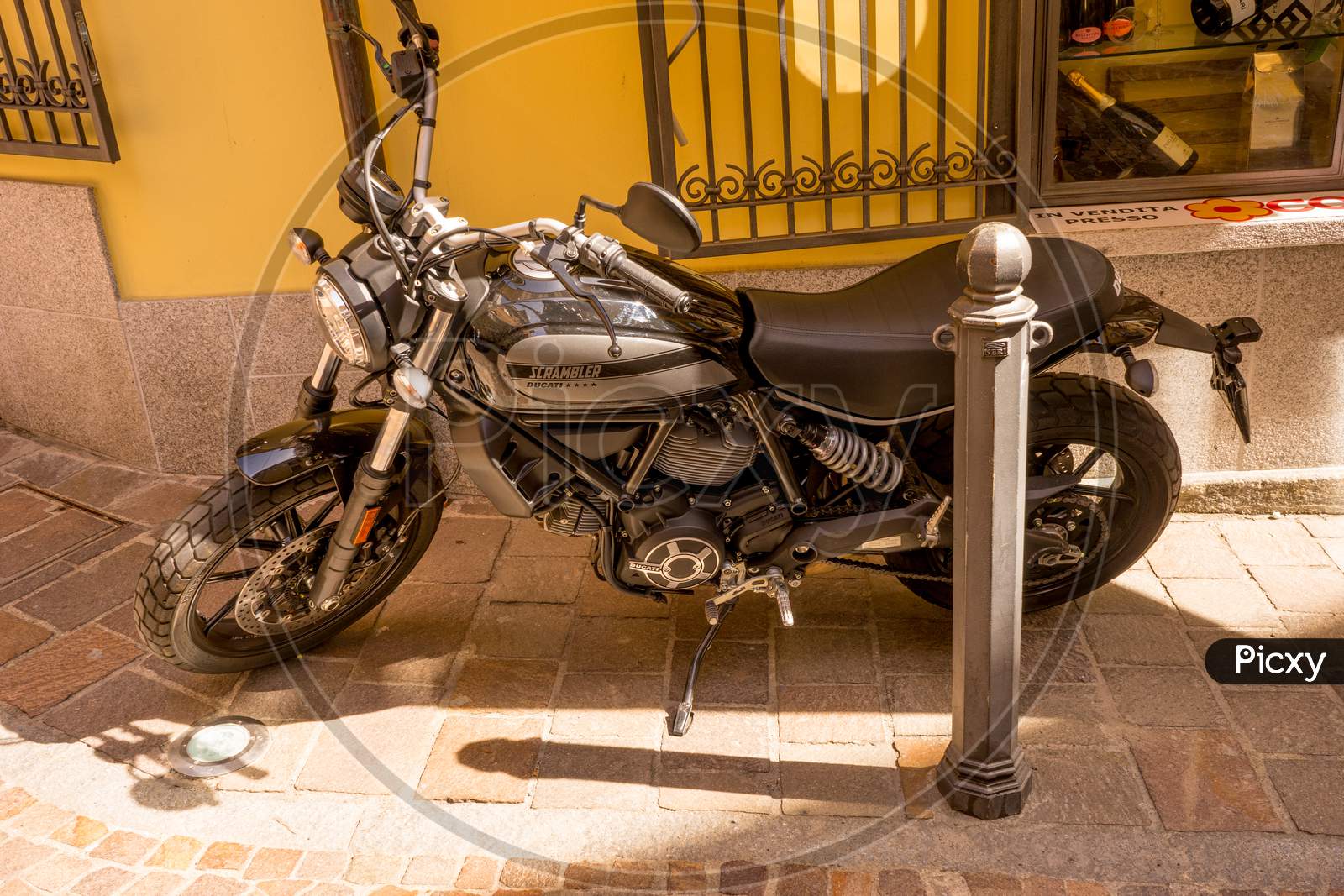 Menaggio, Italy-April 2, 2018: Ducati Scrambler Bike Parked On Road At Menaggio, Lombardy