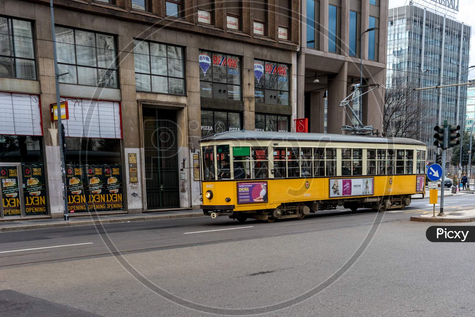 Milan - March 31: An Old Classic Yellow Tram Passes By The Street On March 31, 2018 In Milan, Italy.