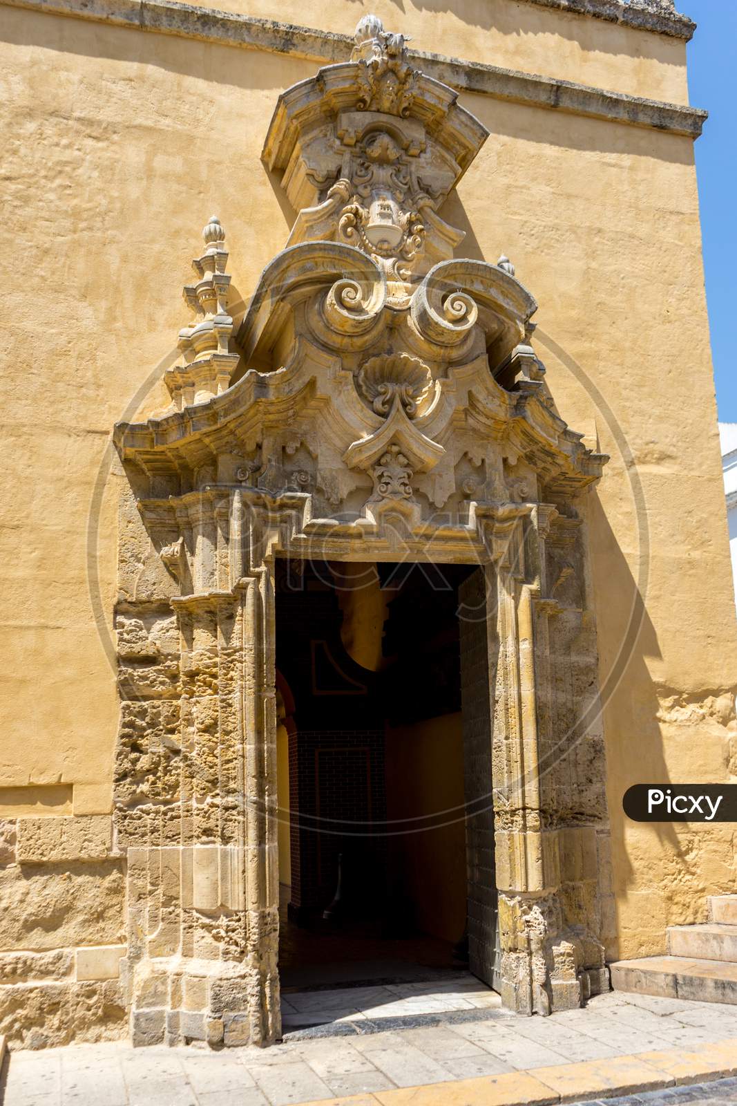 Spain, Cordoba, Low Angle View Of Statue Of Historic Building