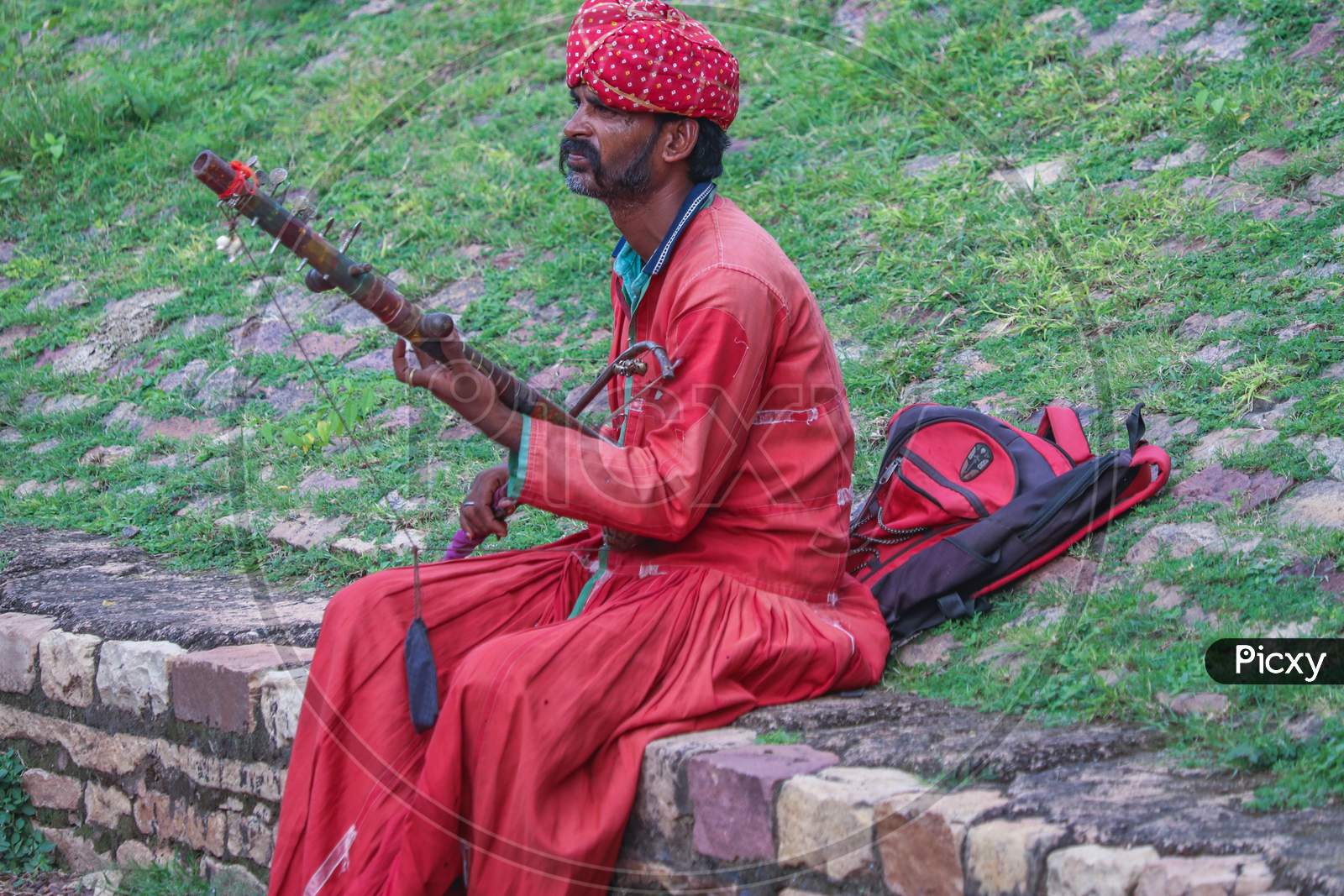 Man playing string instrument