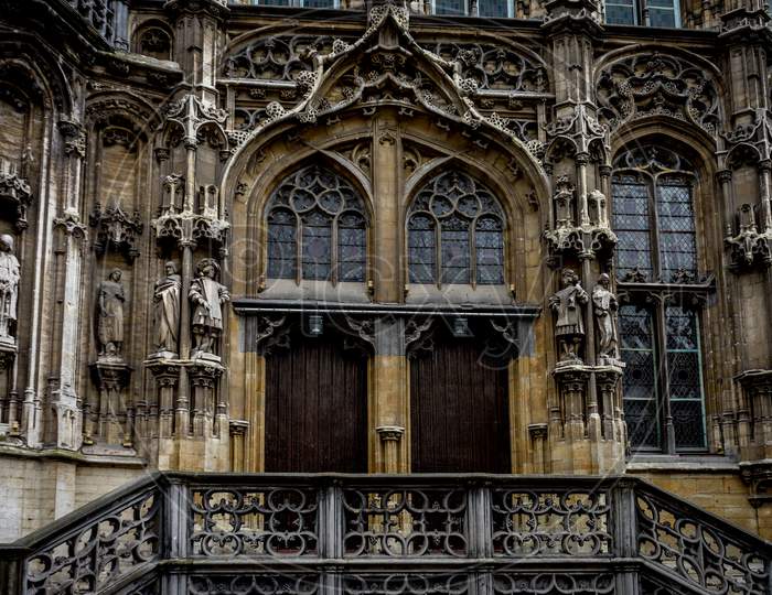 Two Wooden Doors Below An Arch In Ghent