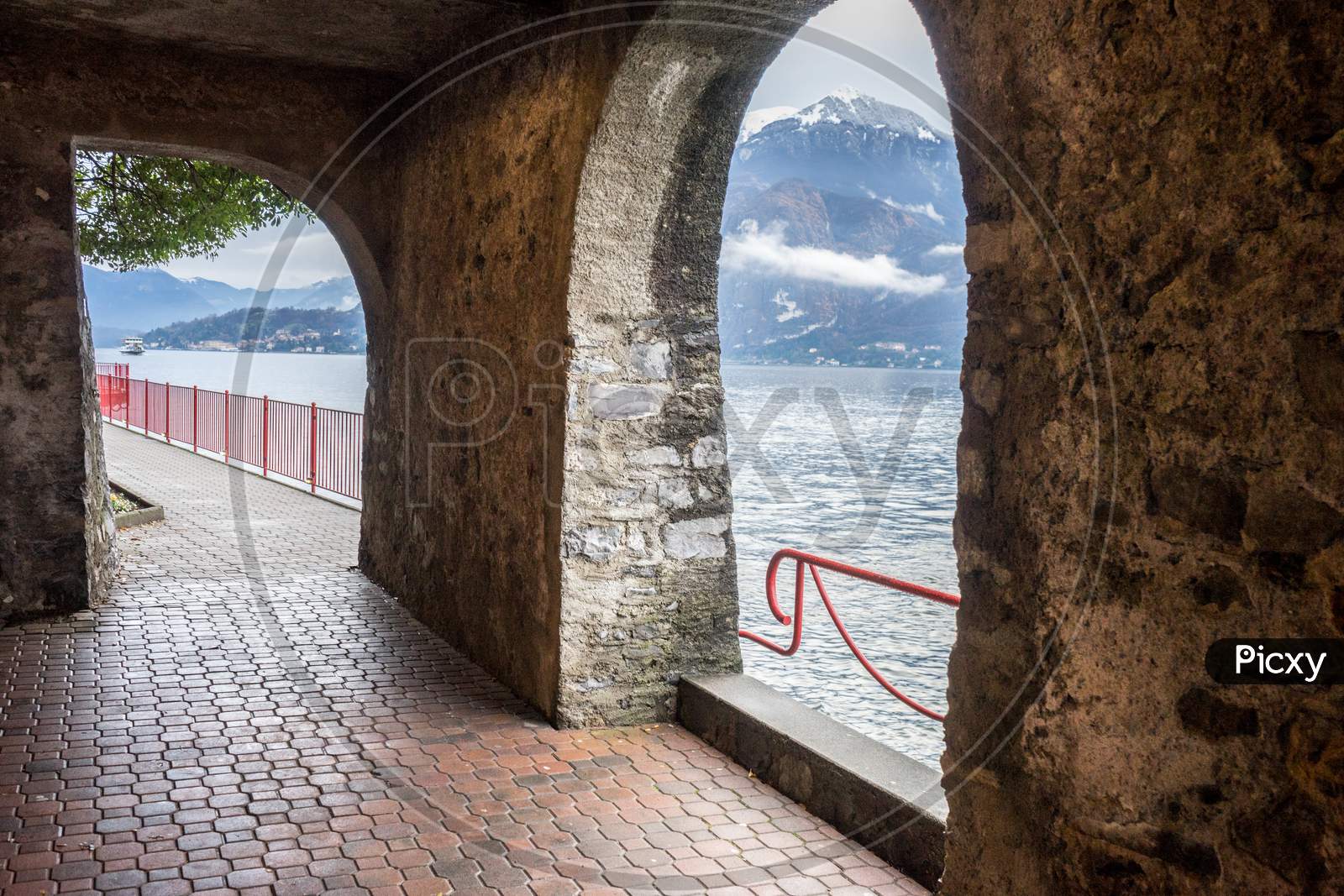 Italy, Varenna, Lake Como, Scenic View Of Sea Against Sky Seen Through Window
