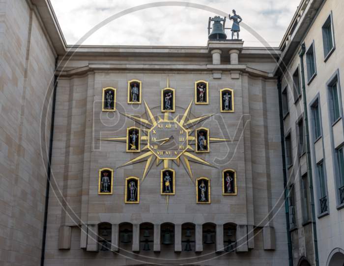 A Clock With A Decoration Of Knights And A Bell On Top In A Clock With A Dcortion Of Knights And A Bell On Top In Brussels, Belgium, Europe
