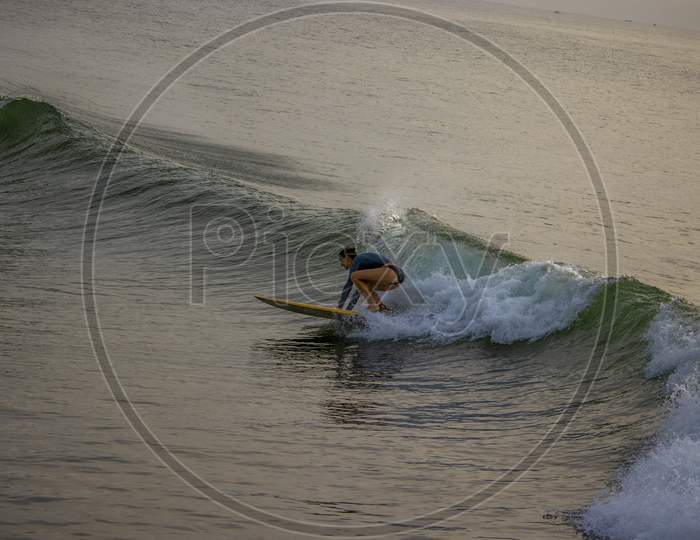 A Foreign Girl Swimming In The Sea On The Waves, Surfing
