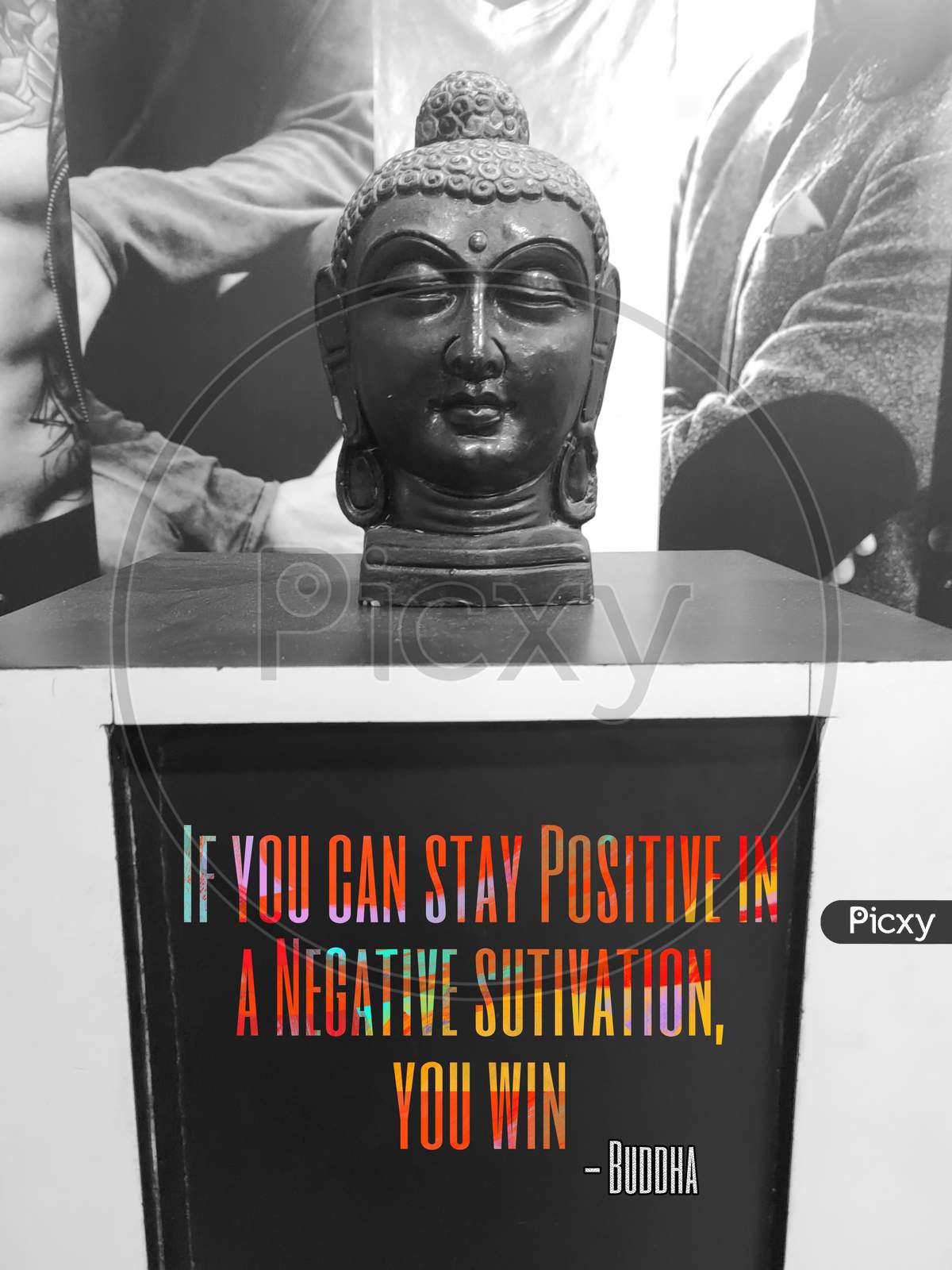 Black coloured home decor piece of Buddha, With the quote. coloured Text