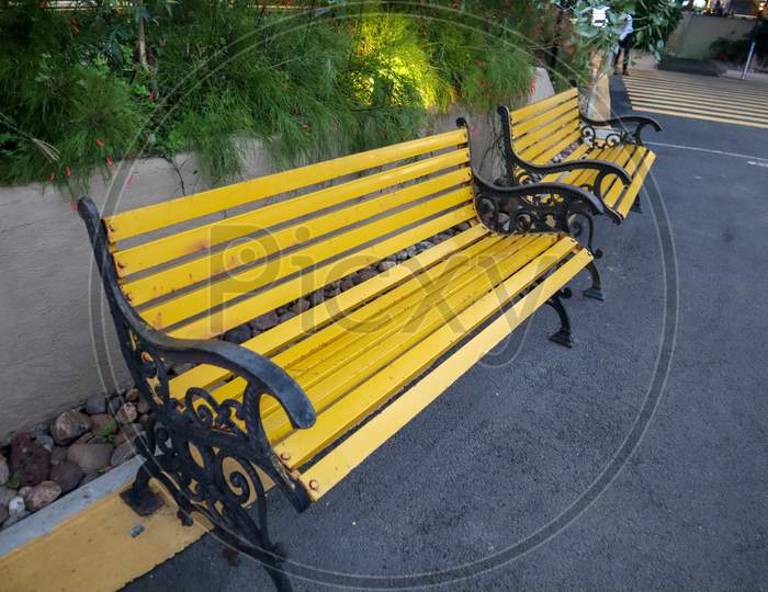 Beautiful Yellow Chairs In A Park. Cool Sitting Area.