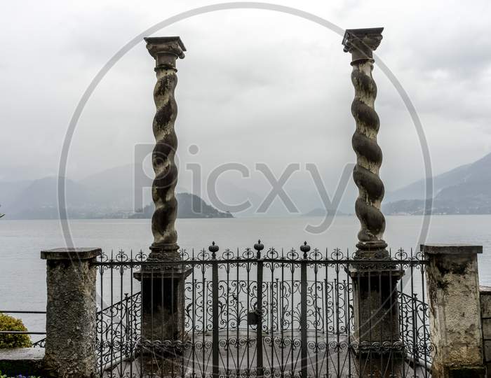 Italy, Varenna, Lake Como,Two Pillars Overlooking The Lake