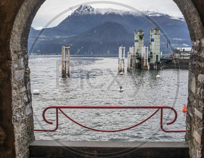 Italy, Varenna, Lake Como, Scenic View Of Moutain Through An Arch