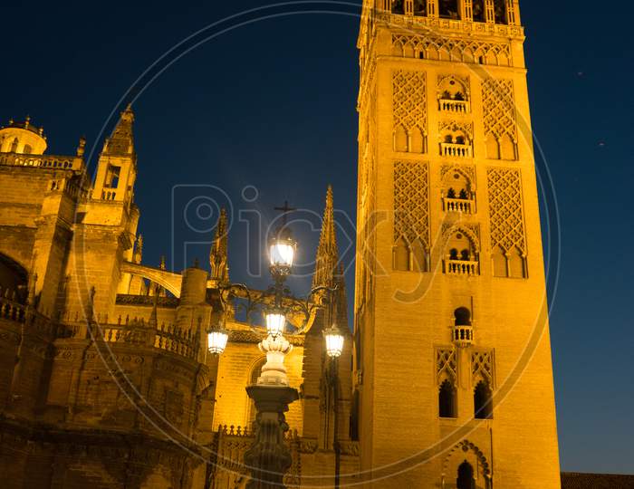 The Giralda Bell Tower Lit Up At Night In Seville, Spain, Europe