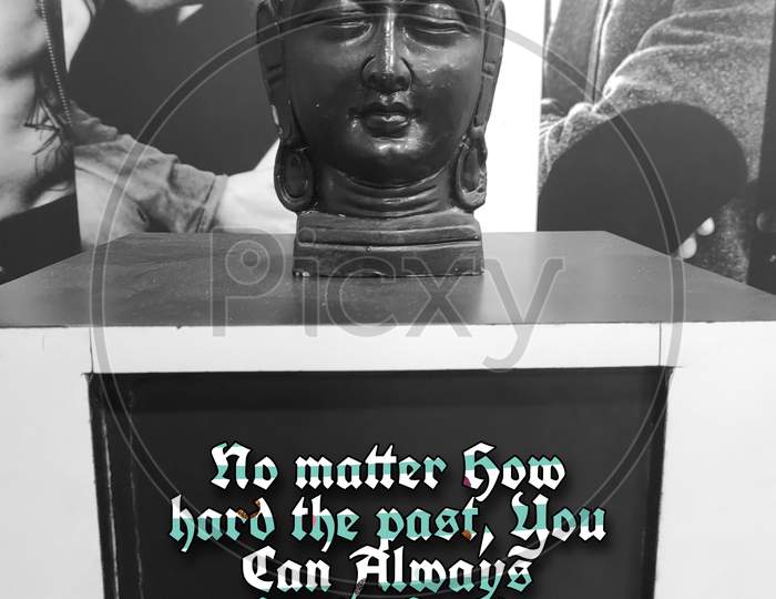 Black coloured home decor piece of Buddha, With the quote