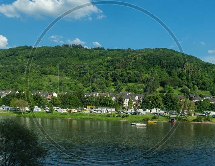 Germany, Hiking Frankfurt Outskirts, A Large Body Of Water With A Mountain In The Background