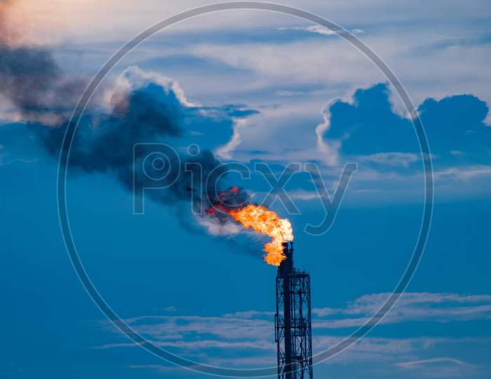 Close Up Industrial View At Oil Refinery Plant Form Industry Zone With Sunrise And Cloudy Sky