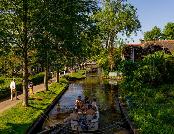 Giethoorn, Netherlands - 26 May: A Tourist Boat On The Canal At Giethoorn On 26 May 2017. Giethoorn Is The Venice Of Netherlands