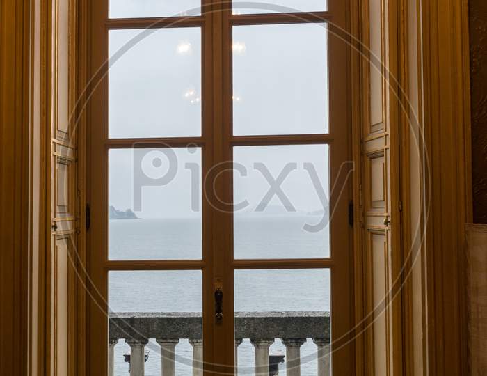 Italy, Varenna, Lake Como, A Bedroom With A Large Window