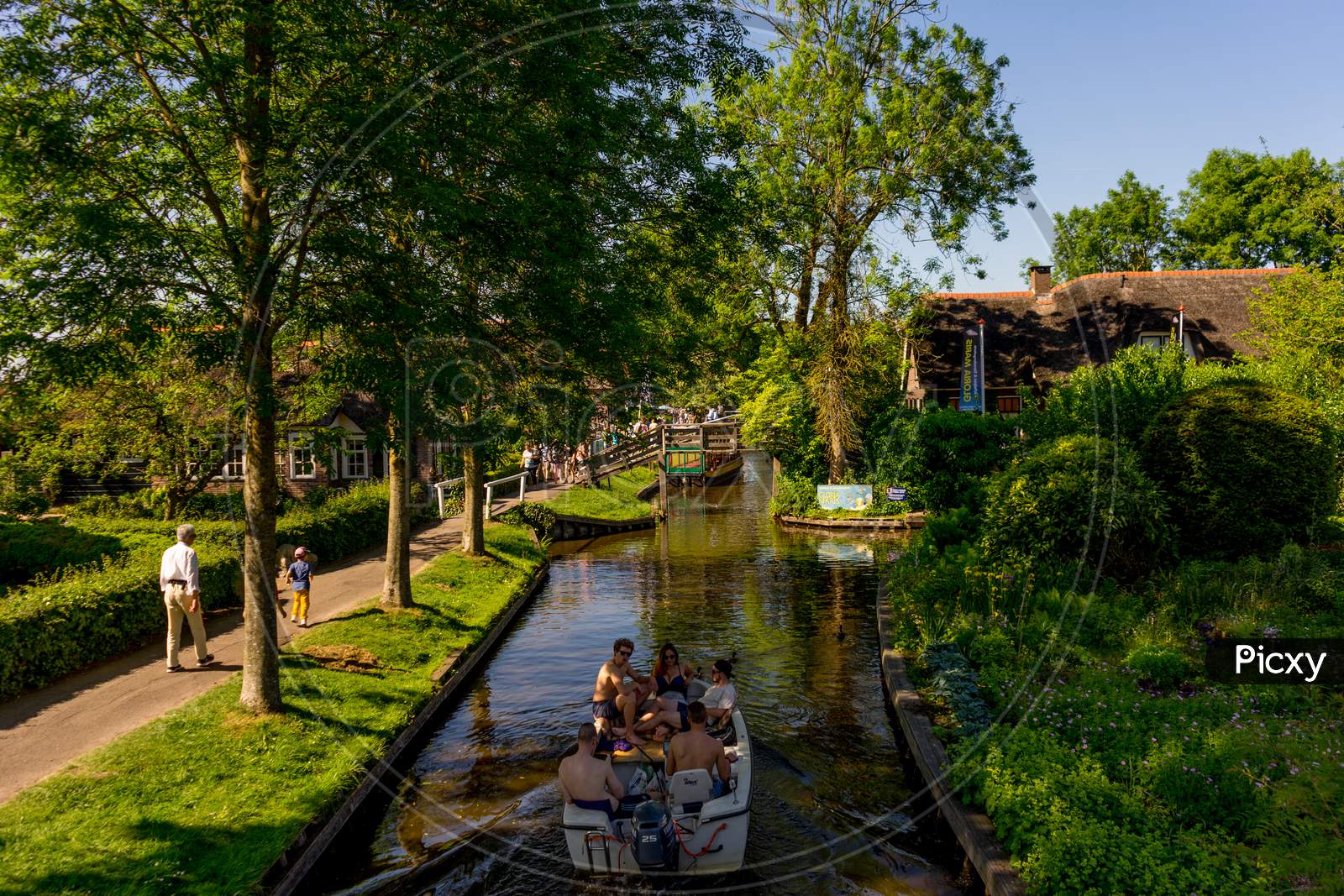Giethoorn, Netherlands - 26 May: A Tourist Boat On The Canal At Giethoorn On 26 May 2017. Giethoorn Is The Venice Of Netherlands