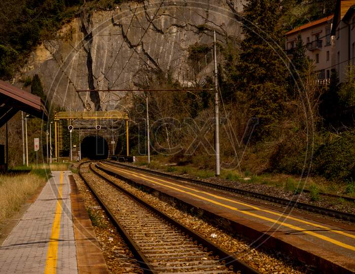 Menaggio, Italy-April 2, 2018: The Track At The Varenna Railway Station Leading Into A Tunnel