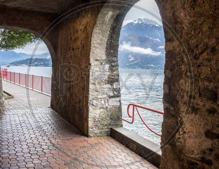 Italy, Varenna, Lake Como, Scenic View Of Sea Against Sky Seen Through Window