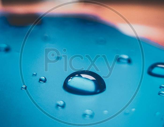 Water droplets blue background