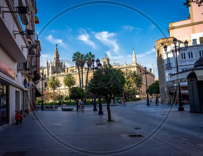 Bell Tower With The Cathedral In Seville, Spain, Europe.