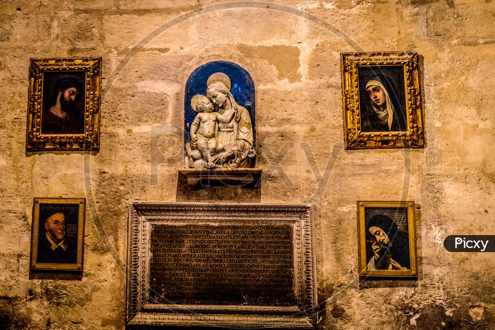 Seville, Spain- June 18, 2017: Artifacts On The Wall Inside The  Gothic Cathedral In Seville, Spain June 2017